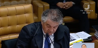 ministro marco aurelio fala sentado em sua cadeira no plenario do stf; foto de reprodução da tv, onde no canto há a intérprete de libras